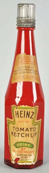 Heinz Ketchup Bottle Display Piece.: Description Circa 1920s. Nice, early, and all original including label and cap. Just some minor wear to label but still displays well.Condition (Excellent). Size 26 - 1/4" T.