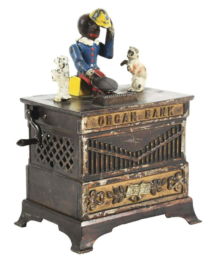 ORGAN BANK CAT AND DOG.: Made by Kyser & Rex. Bank has original trap, crank has been repaired.Condition:(Very Good - Excellent).Dimensions:5 - 1/2" x 4" x 7 - 1/2".