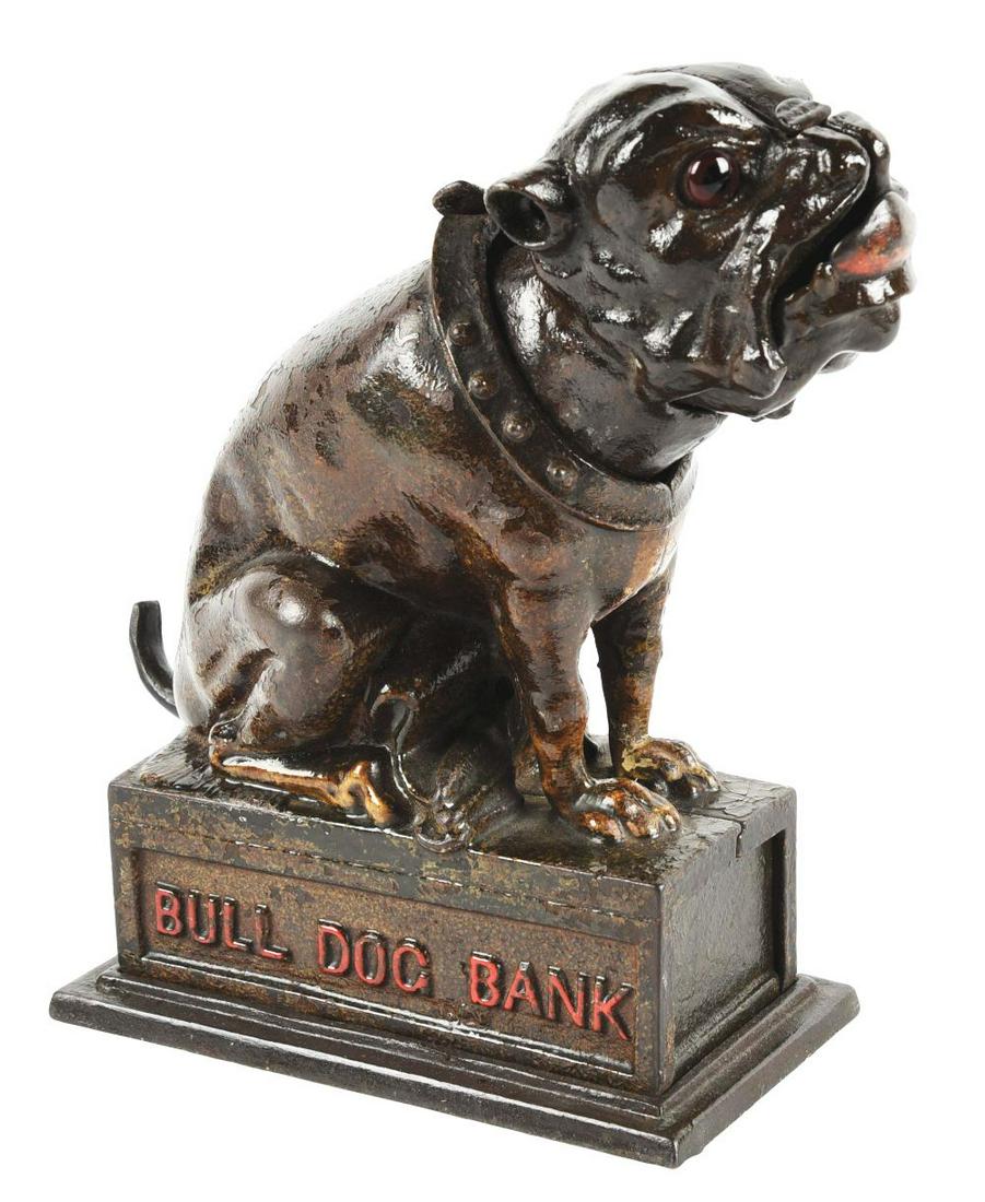 BULLDOG MECHANICAL BANK.: Made by J & E Stevens. Repaired/replaced tail. Reproduction head on original bank, heavily clear coated.Condition:(Poor - Fair).Dimensions:5 - 1/2" x 3" x 7 - 1/2".