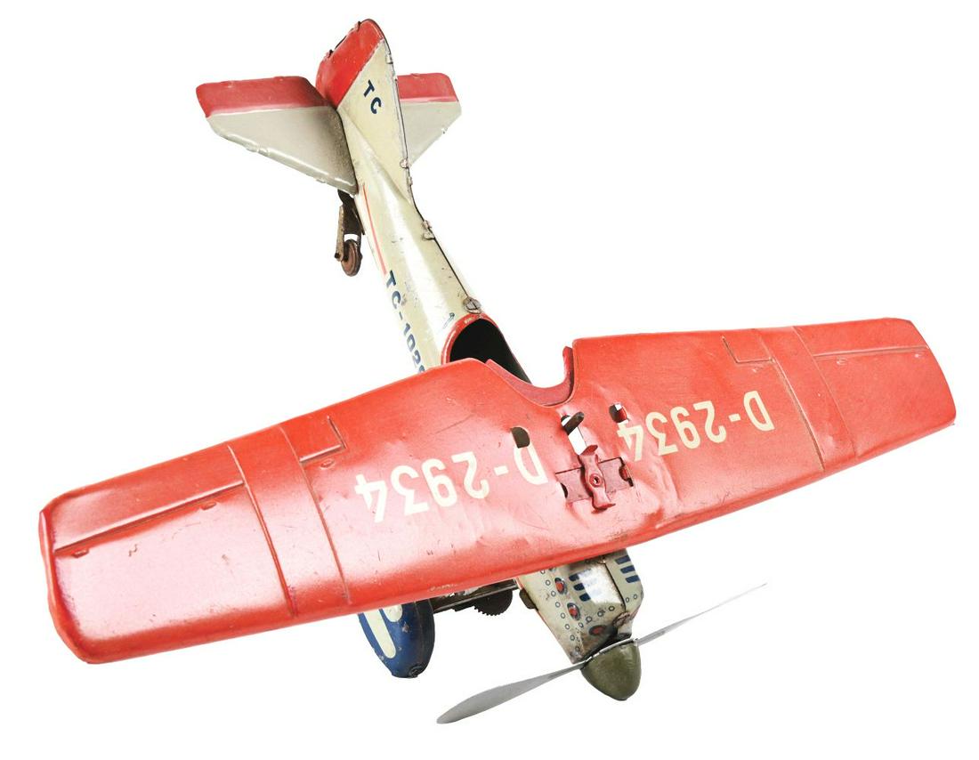 GERMAN TIN LITHO WIND-UP TIPPCO D-2934 TOY AIRPLANE. (1 of 4)