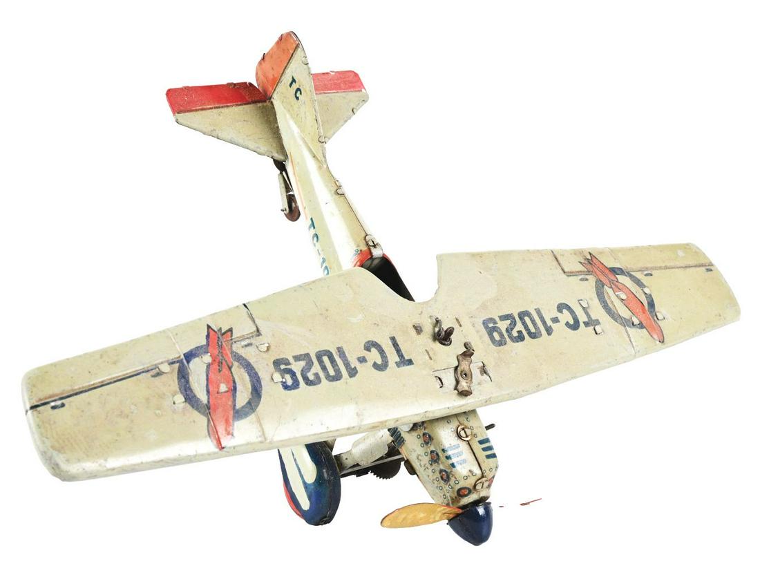 GERMAN TIPPCO TIN LITHO WIND-UP BOMBER AIRPLANE TOY. (1 of 4)