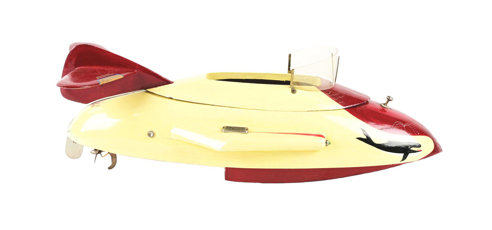 JAPANESE BATTERY-OPERATED "THE WHALE" WOODEN BOAT.: Very unusual design and one of three known to exist. Whales depicted on front nosecone of boat. Original windshield and back fins. Color combination of yellow and maroon on fins on front. Slight red p