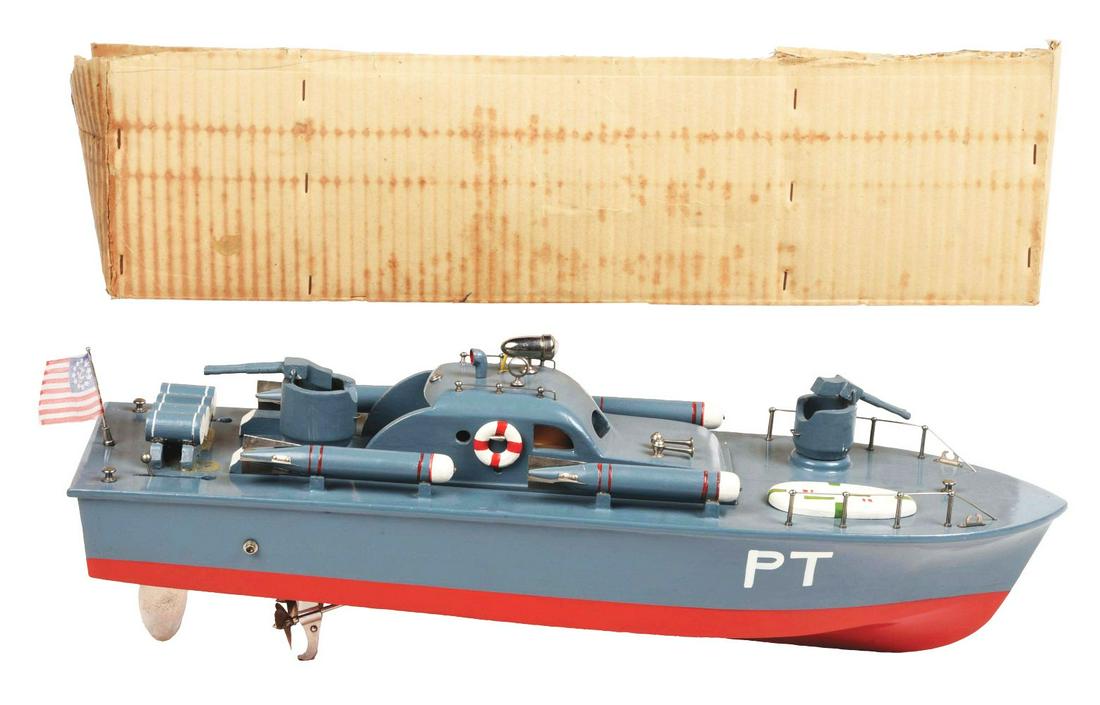 JAPANESE BATTERY-OPERATED WOODEN AMERICAN-STYLE P.T. BOAT.: WWII-type. Includes partial original box, missing lid. American flag and rear of boat marked "PT" on sides. Guns in front and deck torpedo depth charges on both sides of boat. Very little wear. Access