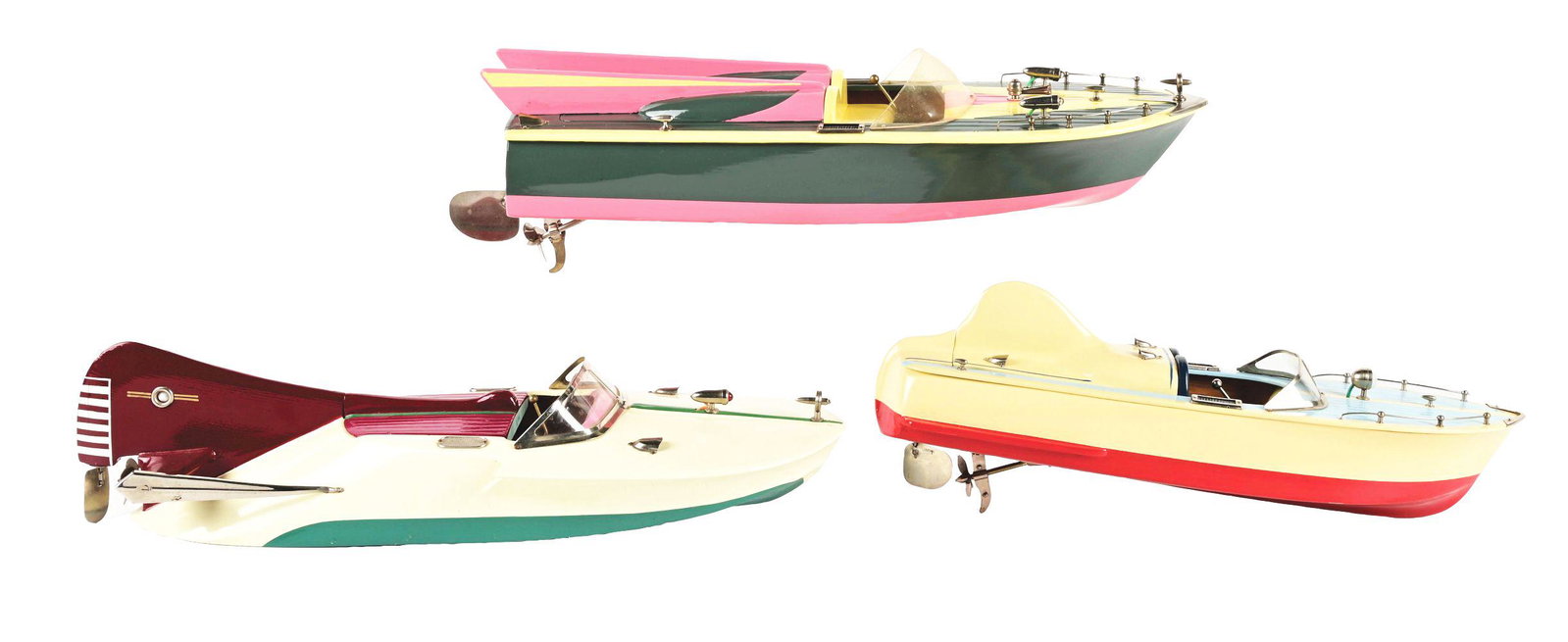 LOT OF 3: UNUSUALLY-STYLED JAPANESE BATTERY-OPERATED WOODEN BOATS.: All racing-style with fins. One rare and very early with a large unusual back fin with metal supports, one is a double fin boat and one with a single smaller middle fin. Nice coloring. Condition:(Very