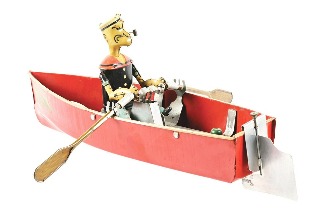 SCARCE TIN LITHO AND PRESSED STEEL WIND-UP HOGE MFG CO. POPEYE THE SAILOR IN ROWBOAT.: Looks to have original pipe, original oars and original rutter. Nice Popeye the sailor decal on one side of boat, marked "No. 268, 1935 King Features Syndicate." Decal is 95%. Looks to be all original