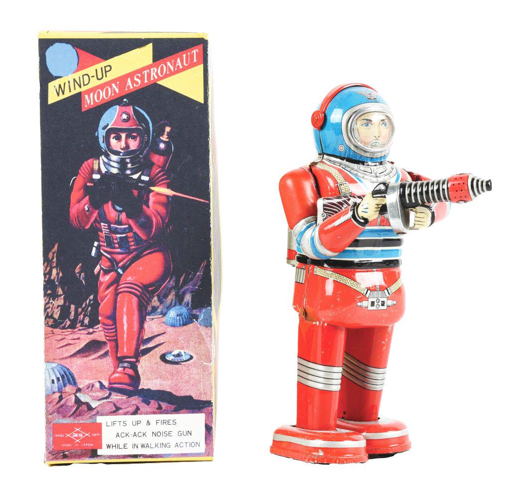 JAPANESE TIN LITHO WIND-UP MOON ASTRONAUT BY DAIYA.: Come with professional reproduction box. One wound astronaut walks with ray gun in hand. Attached key on post is missing. Appears to have scratching and wear throughout.Condition:(Very Good).Dimension