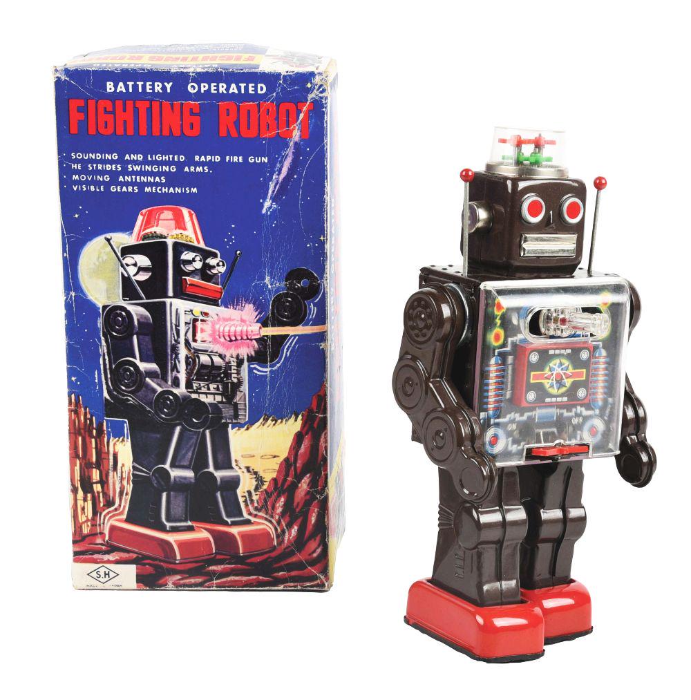 JAPANESE TIN LITHO BATTERY-OPERATED FIGHTING ROBOT IN ORIGINAL.: Marked "SH Horikawa." Nice clean chest plate. On and off switch is a toggle switch at bottom of chest pate. Gears in top head and gun, which rotates back and forth. All tin litho, except top dome and 