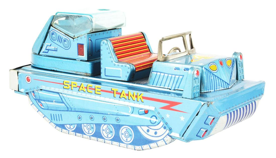 SCARCE JAPANESE TIN LITHO FRICTION SPACE TANK VEHICLE.: Unusual rear gun that would fire probably plastic balls. Gun tube is original, but there are no balls. Marked "Space Tank" on both sides. Nice planet motif on front. Original headlights. Marked "K Jap