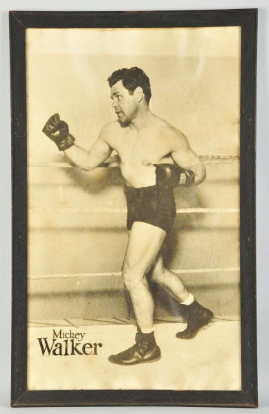 Framed Mickey Walker Boxing Photograph.: Description Shows middleweight Mickey Walker "The Toy Bulldog" in training. Some creasing and water staining.Condition (Very Good). Size Framed: 37 - 1/2" x 23 - 1/2". Framed: 37 - 1/2" x 23 - 1/2".