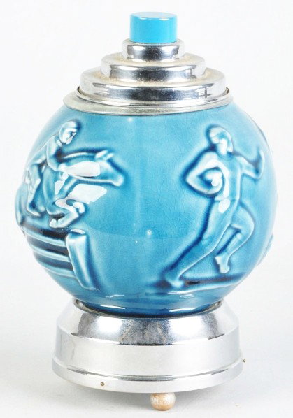 Ceramic Sports-Related Cigarette Dispenser.: Description With music box in bottom. When top is pulled, cigarettes pop out and music plays. Depicts a golfer, fisherman, football player, and steeple horse rider. Some crazing throughout.Condition (