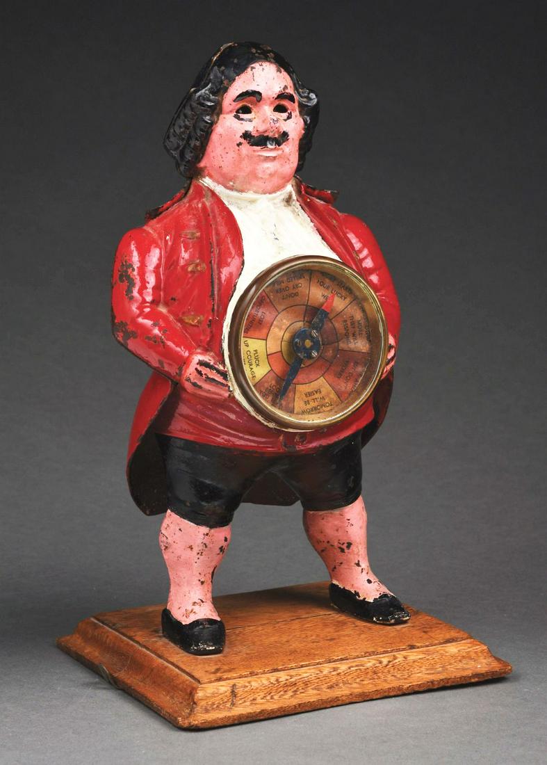 CAST IRON FIGURAL MAN WITH FORTUNE SPINNER. (1 of 4)