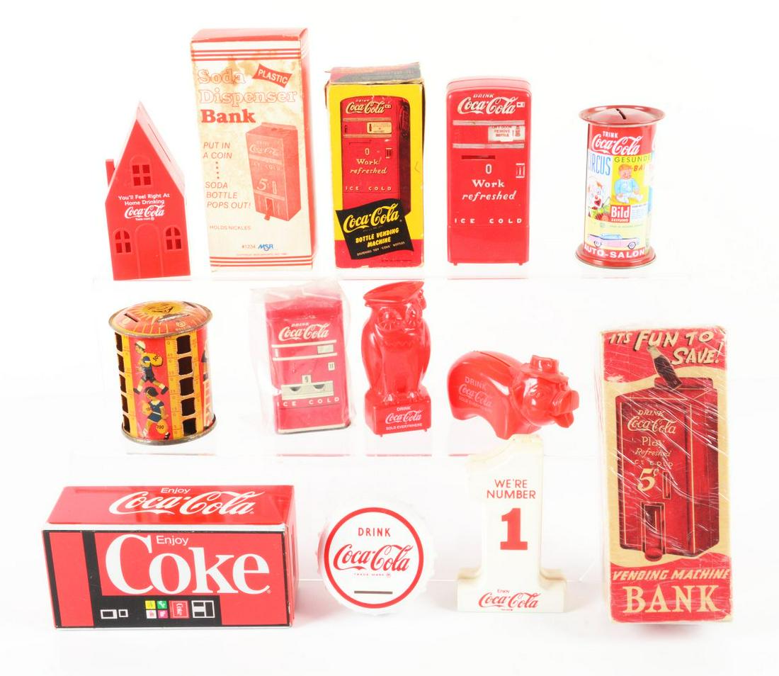 LOT OF 13: COCA-COLA MEMORABILIA BANKS. (1 of 1)