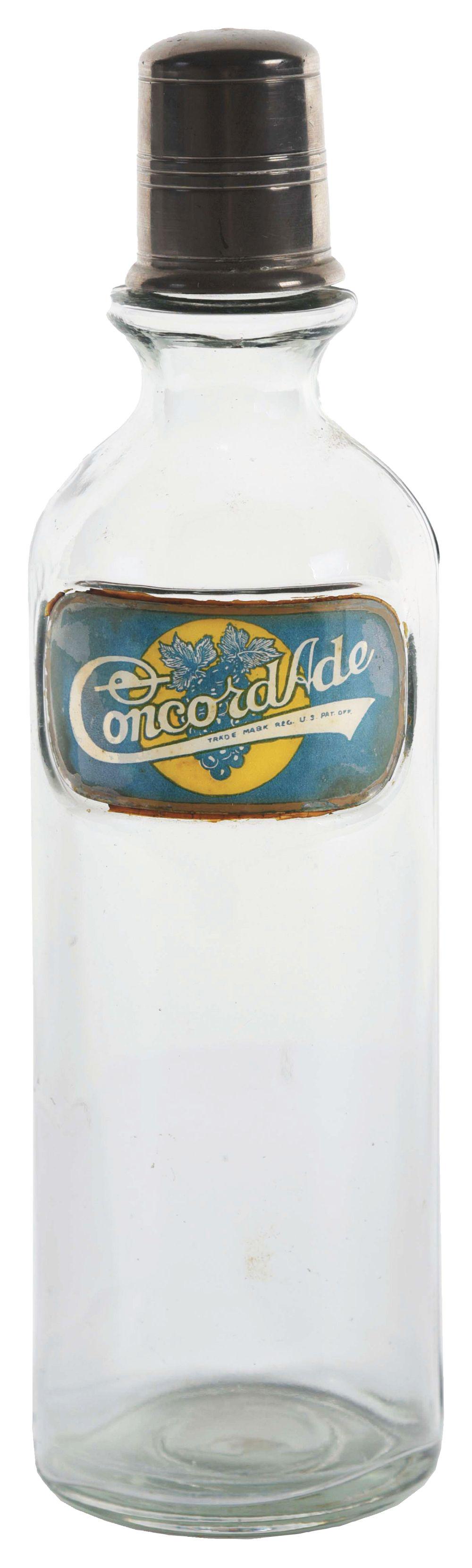 LABEL UNDER GLASS SODA FOUNTAIN SYRUP BOTTLE FOR CONCORDADE.: This soda fountain syrup bottle is a rare brand marked Concordade soda, showing a bunch of concord grapes. The label is complete and unrepaired with some light staining but no chips or cracks. The bot