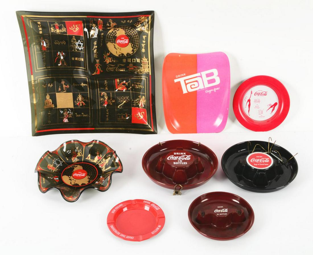 LOT OF COCA-COLA ASHTRAYS.: This is a large lot of Coca-Cola ashtrays, advertising Coca-Cola and Tab. Includes a world dish and a world snack plate. All are in original condition, showing some areas of wear, but no chips, cracks