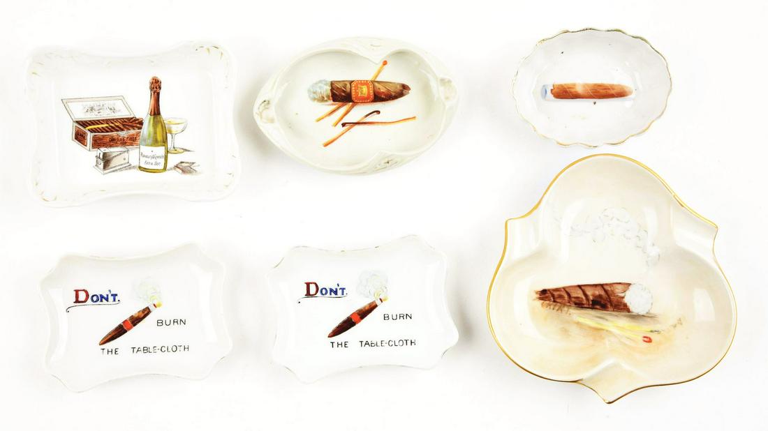LOT OF 6: CIGAR RELATED ASHTRAYS.: This is a lot of six cigar related ashtrays, all are made out of ceramic or china. Marked for various countries including Germany, Bavaria, England, etc. All with a cigar motif. Some appear to have be