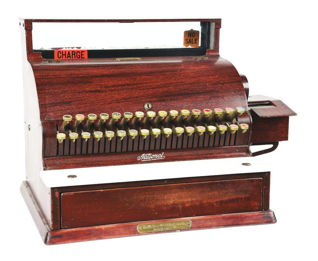NATIONAL CASH REGISTER MODEL 756-G SERIAL NUMBER 1900483.: An early nice example of a 1920 Model 756-G National Cash Register. CONDITION: Showing all original paint, marble shelf, key checks and price flags.Condition:(Good - Very Good).26" x 16" x 18".Dimensi