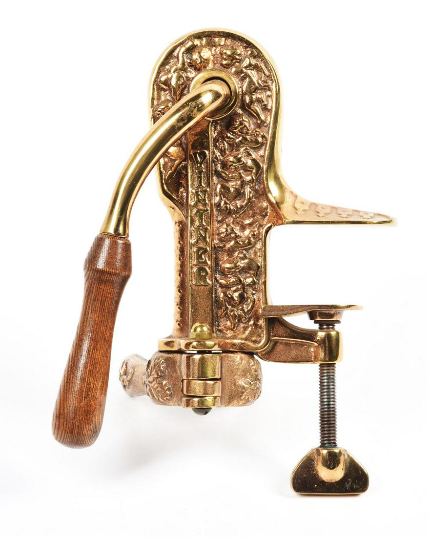 BRASS VINTNER WINE OPENER.: Brass cast wood handle wine cork screw puller. Complete and operative. Condition:(Very Good).8" x 8" x 11".Dimensions: