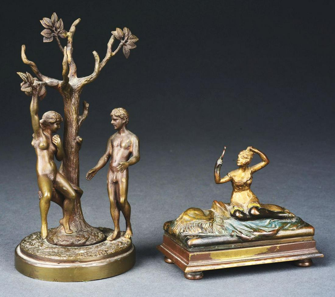 LOT OF 2: BRONZE EROTICA PIECES.: (A) Erotica bronze nude man with woman in tree. Push bottom to move woman into man's arms. Condition: No damage or repairs. (B) Erotica bronze woman sitting on a pillow, looking into mirror. Condition