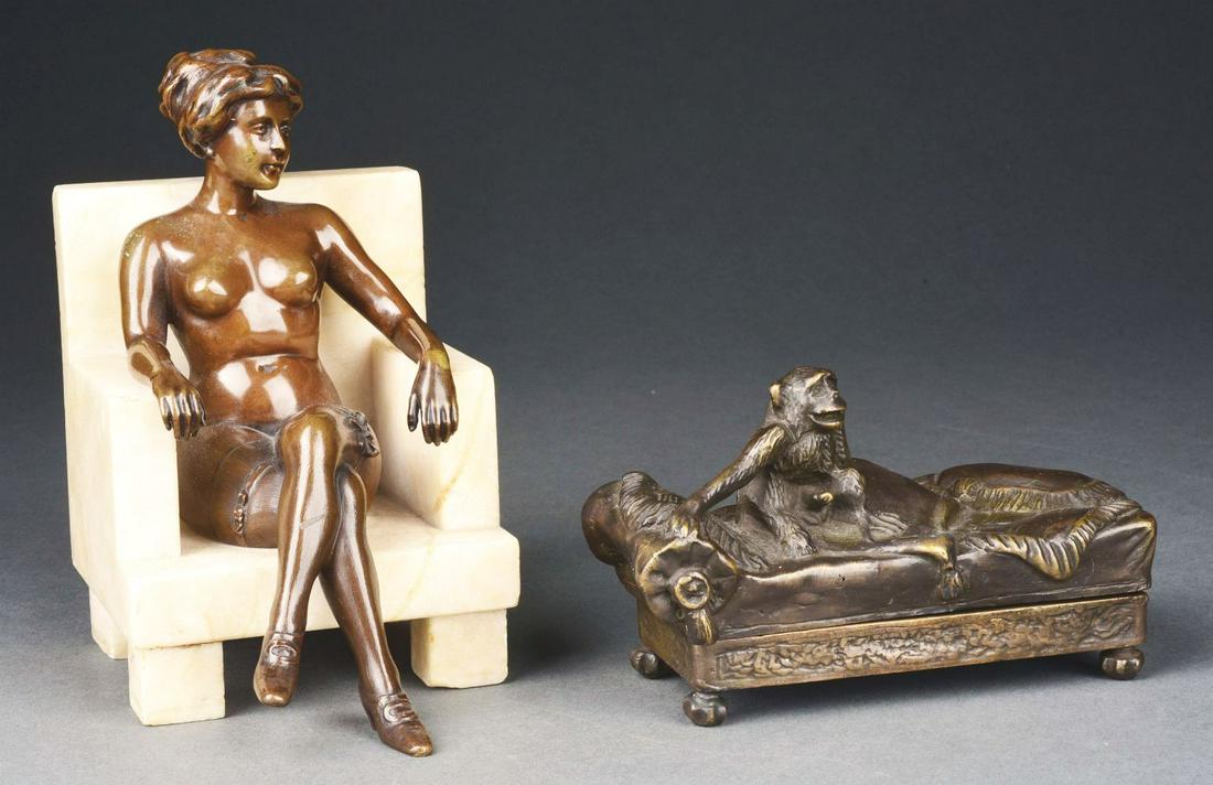 LOT OF 2: EROTICA BRONZE STATUES.: (A) Monkey on a couch with blankets. Condition: No damage or repairs. (B) Nude woman wearing garter, sitting on a marble chair. Condition: Marble has some chips.Condition:(Very Good - Excellent).Large