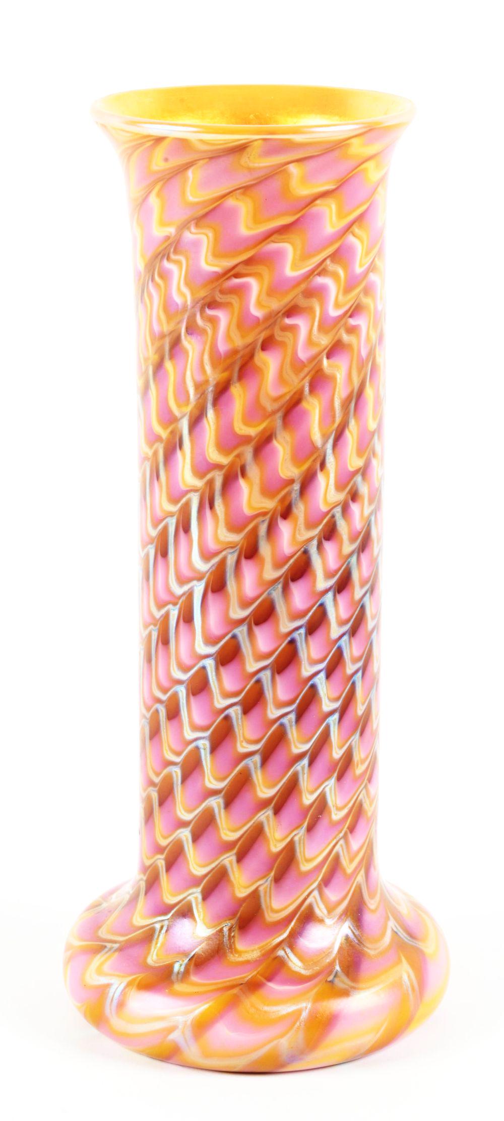 REPRODUCTION LADY GAY ROSE VASE.: Lady Gay Rose design has bands of gold iridescent waves surrounding the cylindrical body of the vase against a rose-colored background. The vase is finished on the interior or the mouth in gold irides