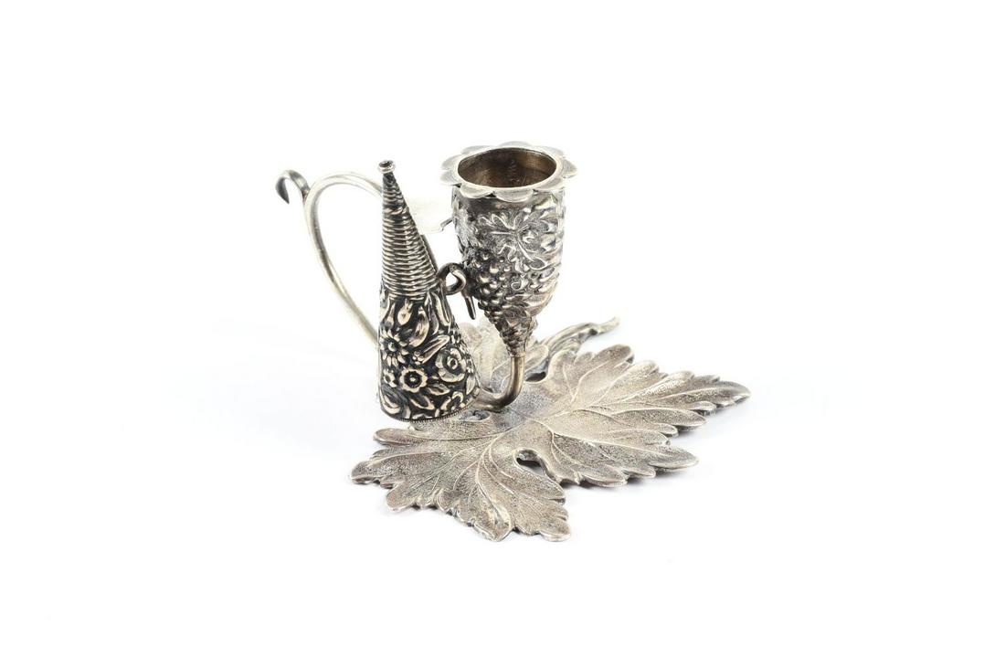 STERLING SILVER MINIATURE CANDLE SNUFFER ON LEAF BASE. (1 of 2)