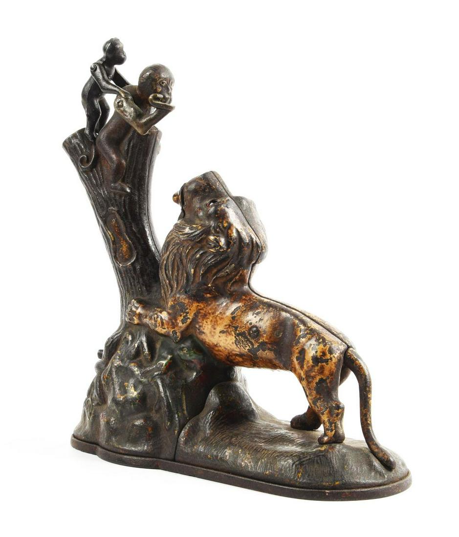 LION & MONKEYS MECHANICAL BANK. (1 of 2)