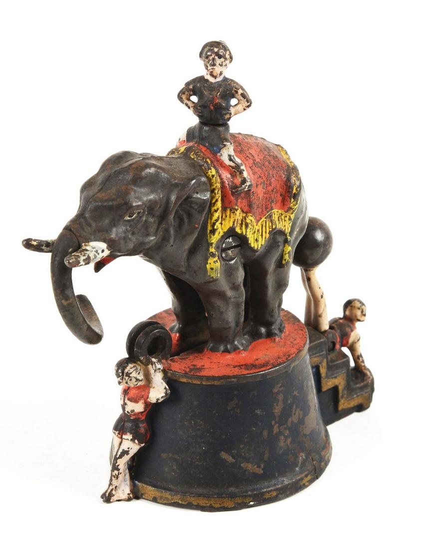 ELEPHANT W/ 3 CLOWNS BANK. (1 of 3)