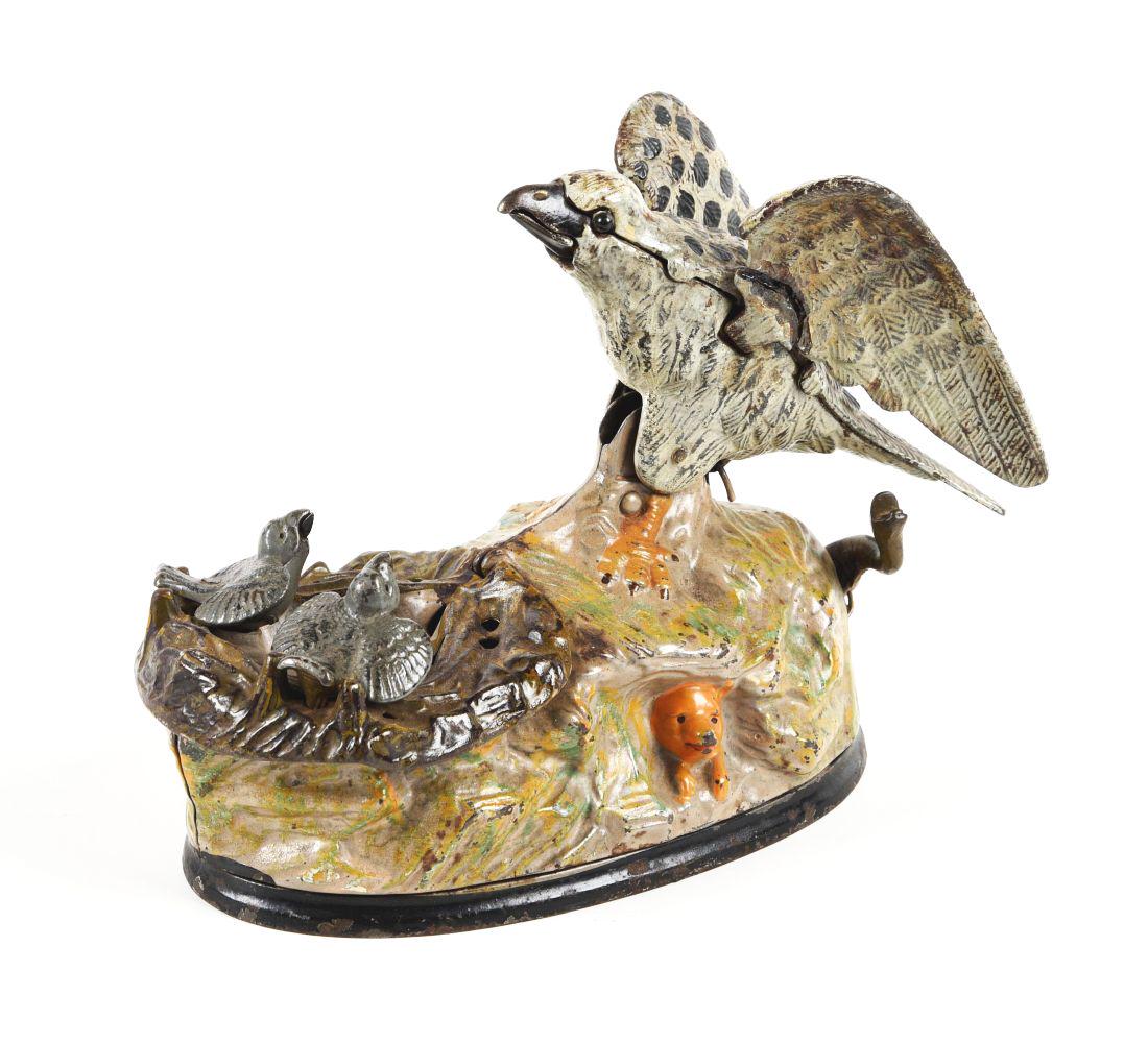 EAGLE AND EAGLETS.: Made by J & E Stevens. Replaced eyes, one wing is broken and glued. Original trap and loud bellows. Condition:(Restored).8" x 4" x 6".Dimensions: