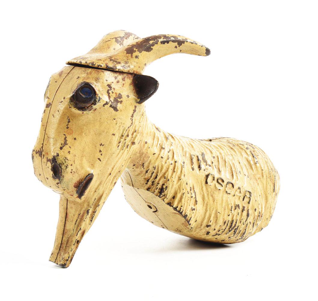 OSCAR THE GOAT BANK/DOORSTOP ORIGINAL EXAMPLE.: Missing both sets of legs.Condition:9" x 3 - 1/2" x 7".Dimensions: