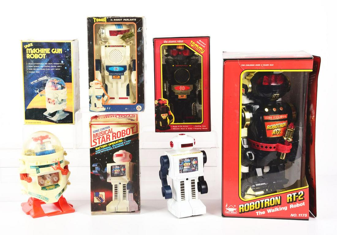 LOT OF 5: BOXED VARIOUS MOSTLY MADE IN HONG KONG BATTERY-OPERATED ROBOTS IN ORIGINAL BOXES.: Includes a Robotron RT-2, Atomic Robot, space machine gun robot, Tobor Robot and Musical Star Robot. Boxes appear to have creasing and wear.Condition:(Very Good).Largest Box: 17" x 9" x 7 - 1/2".Dimen