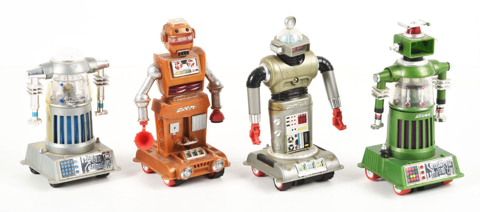 LOT OF 4: HONG KONG-MADE ZEROIDS-TYPE ROBOTS.: Marked "Ideal Hong Kong" on bottom. Looks to be mostly complete. Treads are torn and missing on all four. Condition:(Very Good).Largest: 6 - 1/4" x 2 - 3/4" x 2 - 3/4".Dimensions: