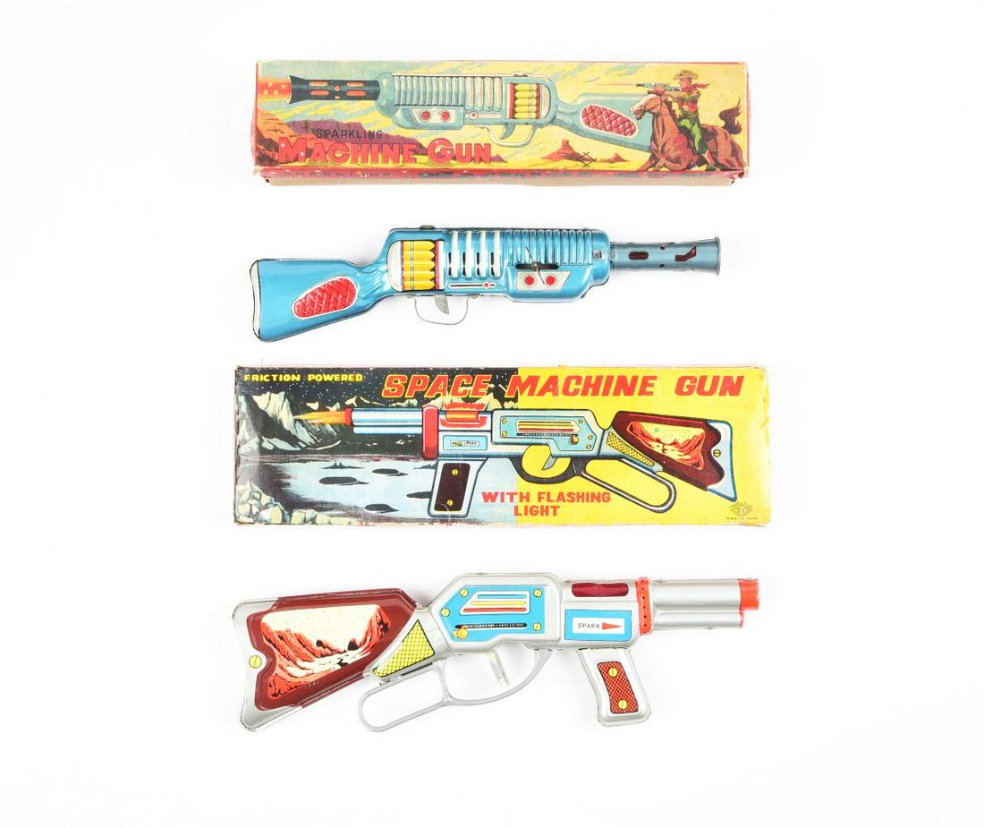 LOT OF 2: JAPANESE TIN LITHO TOY MACHINE GUNS IN ORIGINAL BOXES.: One is a Space Machine Gun, and the other is a Western Wind-Up Machine Gun. Space Machine Gun is friction.Condition:(Very Good - Excellent).Largest Box: 13 - 1/4" x 4" x 1".Dimensions: