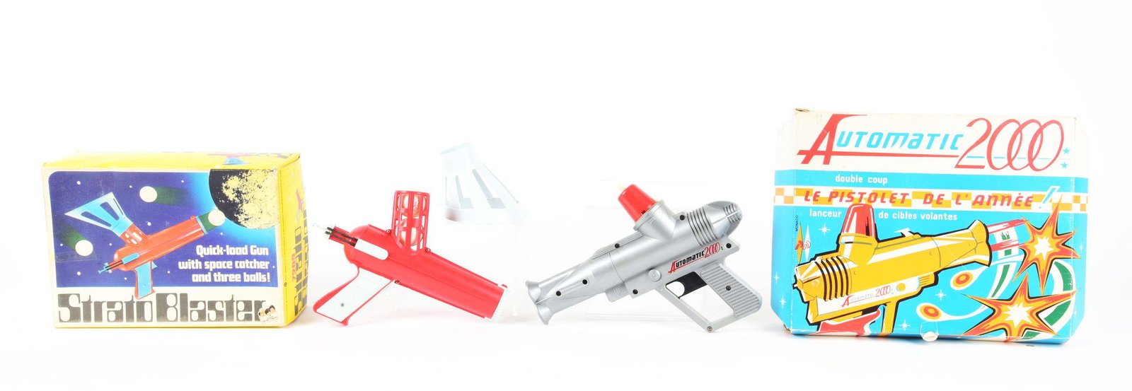 LOT OF 2: EUROPEAN PLASTIC SPACE GUNS IN ORIGINAL BOXES.: Strattoblaster is made in England, and the other is an Automatic 2000 French Pistol with darts and saucers.Condition:(Very Good - Excellent).Largest Box: 14 - 1/2" x 11 - 1/4" x 2 - 1/4" .Dimensions: