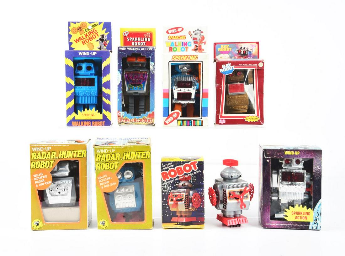 LOT OF 8: BATTERY-OPERATED & WIND-UP PLASTIC ROBOTS IN ORIGINAL BOXES. (1 of 1)