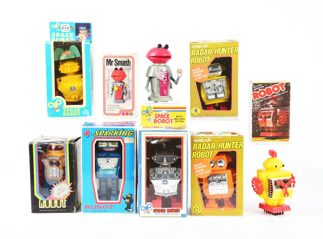 LOT OF 8: BATTERY-OPERATED & WIND-UP PLASTIC HONG KONG ROBOTS IN ORIGINAL BOXES. (1 of 1)
