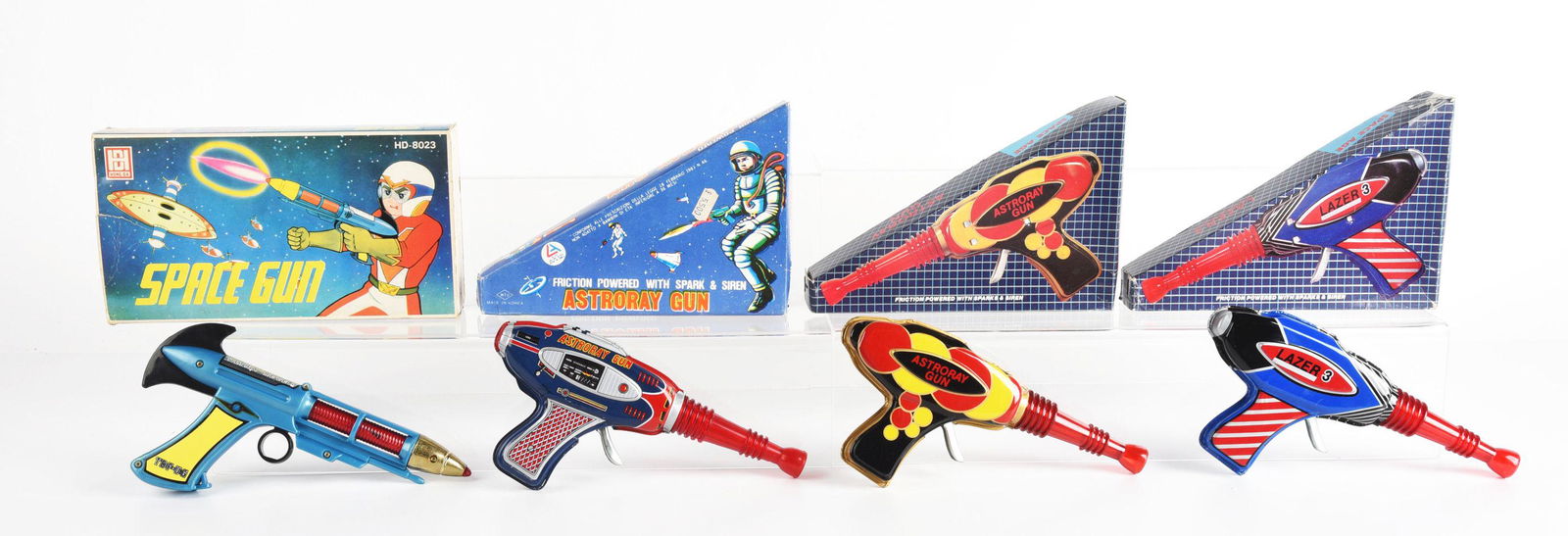 LOT OF 4: TIN LITHO & PLASTIC FOREIGN MADE SPACE GUNS IN ORIGINAL BOXES. (1 of 2)