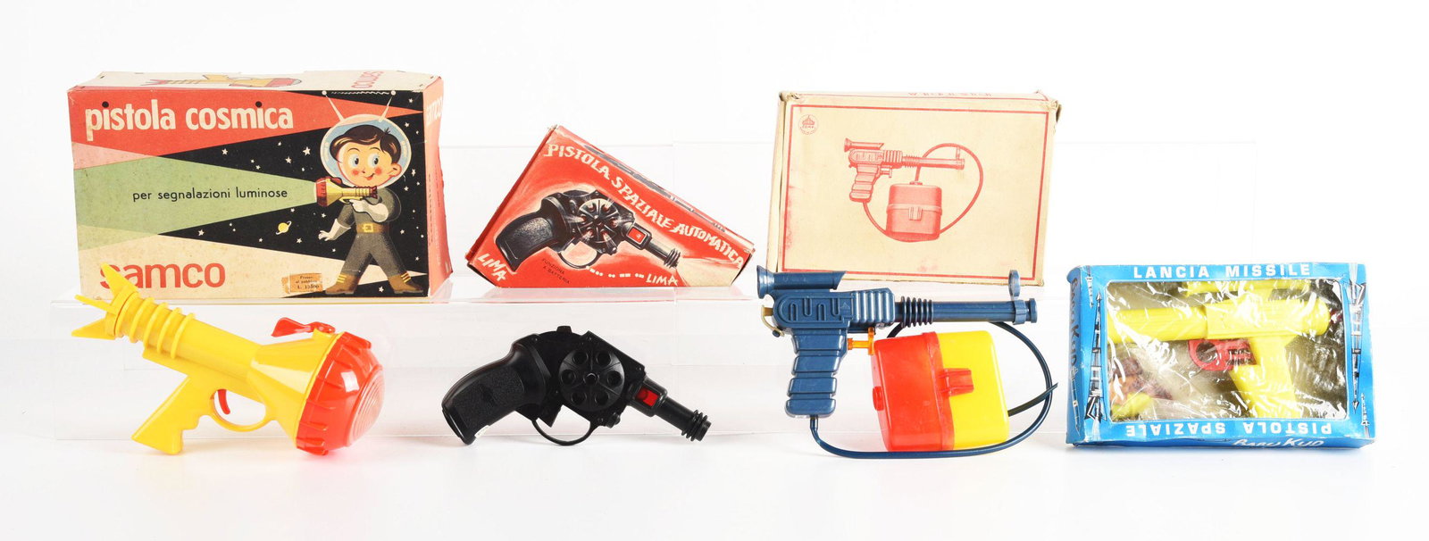 LOT OF 4: ITALIAN MADE PLASTIC SPACE PISTOLS IN ORIGINAL BOXES.: There is a Lancia missile gun, automatic pistol, Samco, and a sieirbat pistol. Boxes have some wear.Condition:(Very Good).Largest Box: 10" x 6" x 3 - 3/4".Dimensions: