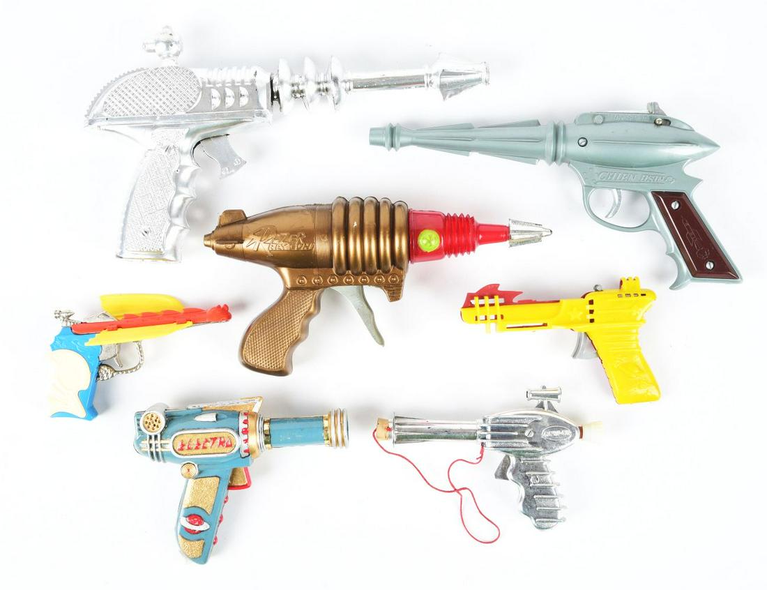 LOT OF 7: VARIOUS-MADE PLASTIC SPACE GUNS. (1 of 1)