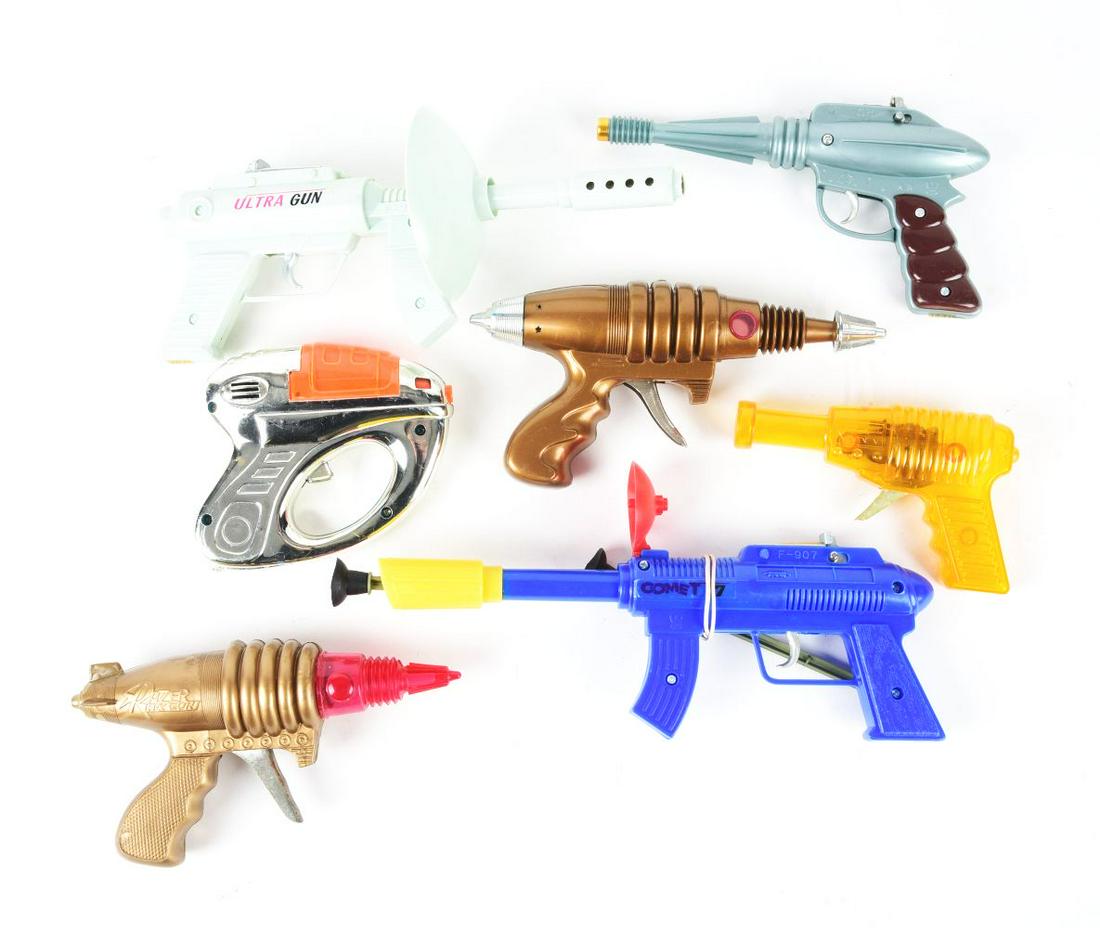 LOT OF 7: VARIOUS TAIWAN & CHINA SPACE GUNS.: All plastic, includes three colorful header cards. Ultra gun, Comet gun and others. Condition:(Very Good - Excellent).Largest: 12" x 6" x 3/4".Dimensions: