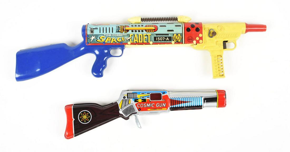 LOT OF 2: TIN LITHO & PLASTIC SPACE RIFILES.: One is a friction Cosmic gun made in Japan. The other is a Tom Corbett Marx Space Cadet rifle wind up and working, but the front barrel is warped.Condition:(Good - Very Good).Largest: 21" x 5 - 1/2" x