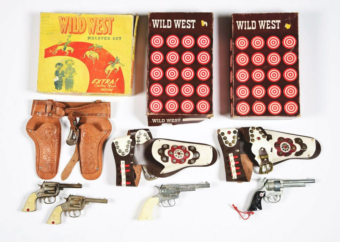 LOT OF 3: WILD WEST HOLSTER SETS.: All in original boxes. There is a double set with Buffalo Bill pistols. Original box has some writing on it and some damage to side aprons. Two identical boxed Wild West sets, one has a Pony Boy singl