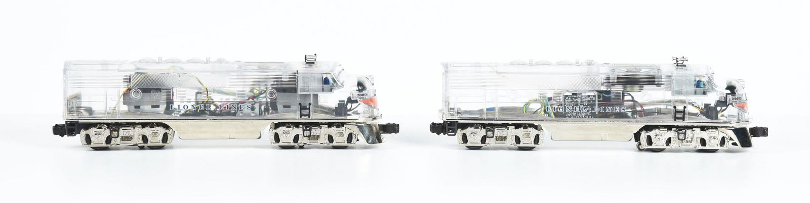 LOT OF 2: LIONEL CONTEMPORARY F-3A POWERED AND NON POWERED CLEAR CAB TRAIN ENGINES. (1 of 2)