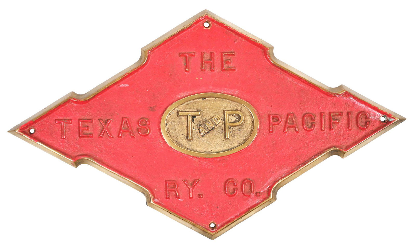 PASSENGER CAR LOGO PLATE.: Cast bronze plate in the Texas and Pacific logo shape. Has red field paint with polished center and logo. This plate is from the end of a passenger car. Condition: (7.0). Dimensions: 16" x 9 - 1/2".