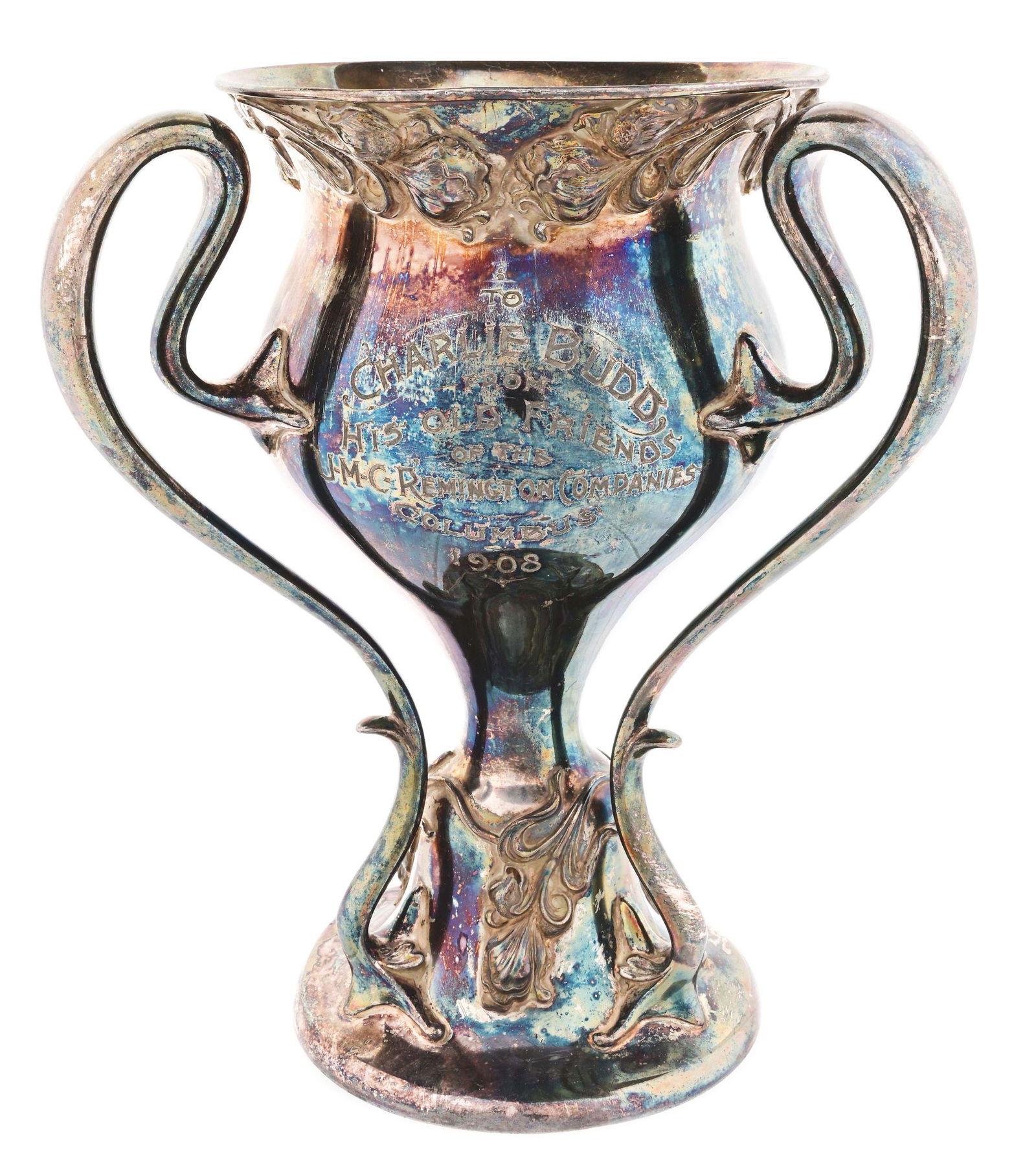 1908 REMINGTON-UMC SILVER PLATED TROPHY PRESENTED TO SHOOTER CHARLIE BUDD.: The front of the trophy reads "TO / CHARLIE BUDD / FROM / HIS OLD FRIENDS / OF THE / U-M-C REMINGTON COMPANIES . COLUMBUS / 1908" It is 10" tall and has 3 handles. The maker mark on the bottom reads "