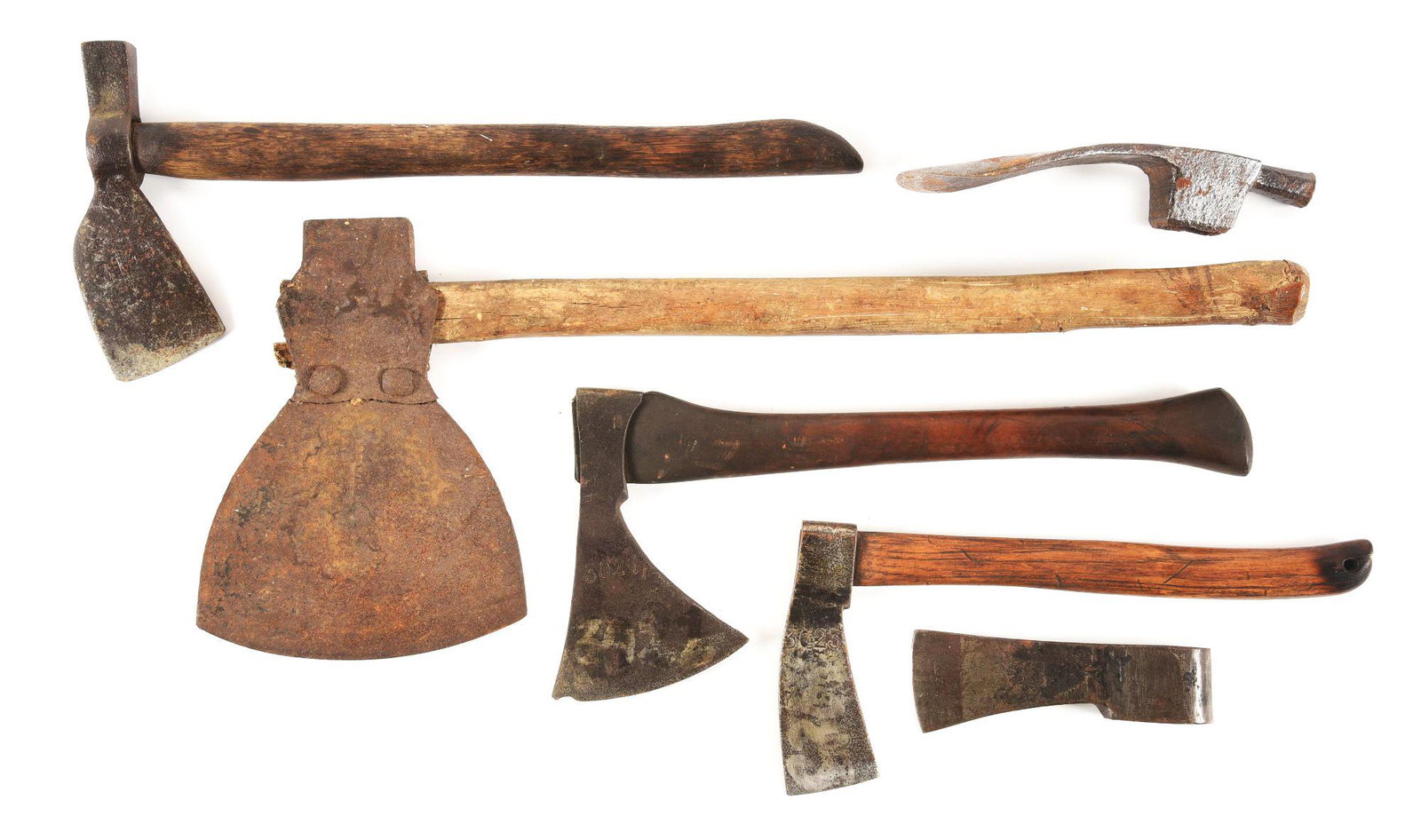LOT OF 7: HAND AXES AND AXE HEADS: Lot consists of:(A) Forged iron hammer axe. Marked: "PASCAL / AIX/ 3148". Measures: 8 - 1/4" blade, 19" on the haft. (B) Marked "T. BENJAMIN N. YORK". Blade measures 7", on the haft 24". (C) Hand axe 