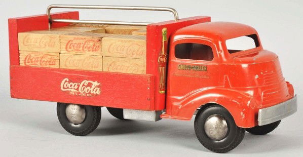 Coca-Cola Smith-Miller Truck.: Description 1940s. Metal and wood with wooden simulated cases. Play wear with a few chips and nicks to both the painted and wooden surfaces. Condition (Excellent). Size 13 - 1/4" L.