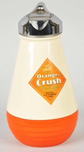 Orange Crush Fiesta-Style Syrup Pitcher.: Description Circa 1930s to 1940s. Clean and bright with only normal overall crazing (mostly visible on white surface). Also has some minor fading to front transfer and light wear or soiling overall. C