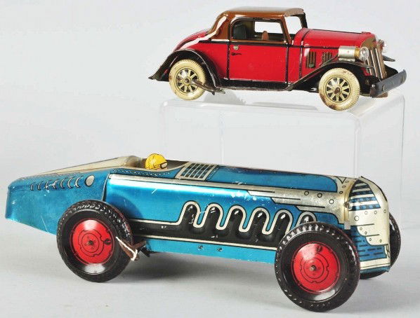 Lot of 2: Tin Litho Marx Automobile Wind-Up Toys.: Description American. Working. Includes one coupe with electric headlights and very little wear and one race car with some scratching and wear. Condition (Very Good - Excellent). Size Largest: 13" L.