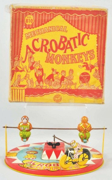 Tin Litho Wyandotte Acrobatic Monkeys Wind-Up Toy: Description American. Working. When wound, clown on motorcycle hits monkeys and makes them spin as he rides around track. Some minor to moderate wear overall. Includes very colorful original marked "N
