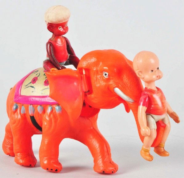 Celluloid Henry on Elephant Wind-Up Toy.: Description Japanese. Working. Pink elephant variation. No denting or cracking. Condition (Excellent). Size 8" L.